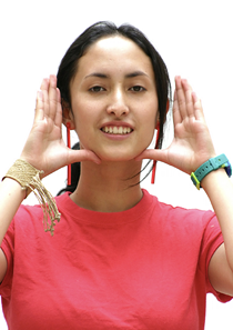 Photo of a young woman with hands near face