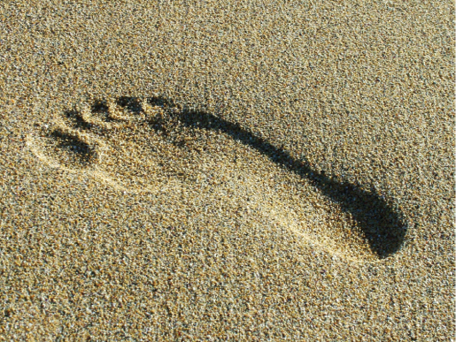 Photo of a footprint in the sand